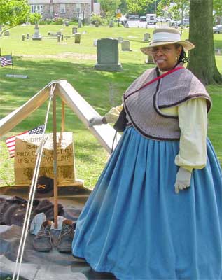 Barbara Barksdale at the grave of Pvt. Andrew Hill, 6th USCT.