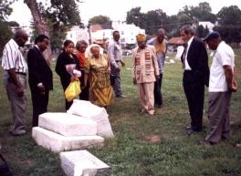 Calobe Jackson, Jr. points out nearby tombstones of interest to the Chester descendants. Click for a larger image.