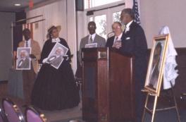 Frederick Douglass IV presents prints of his great-great- grandfather. Click for a larger image.