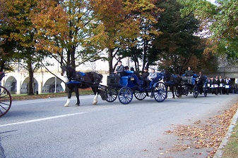 Grand Review dignitaries in carriages on Front Street.