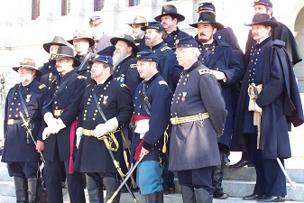 Civil War officer re-enactors pose on Capitol steps after parade.