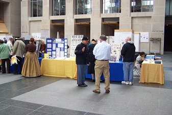 Attendees viewing the history exhibits during the event.