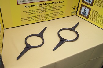 Close-up picture of slave collars exhibited at event.